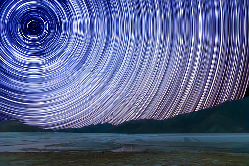 Witness the mesmerizing dance of North Star trails as they paint the night sky above the frozen Pangong Lake in Ladakh. A celestial spectacle that beckons photographers to capture its ethereal beauty.