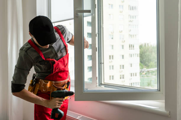 istock master with a screwdriver sets fittings on the window 1589759375