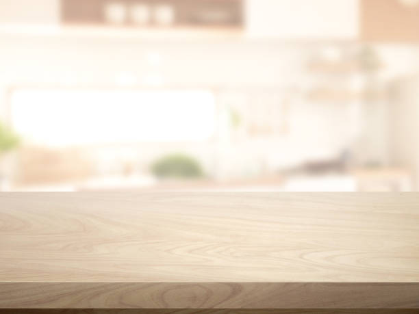 istock Wooden table. Blurred image of the kitchen in the background. 1589762187