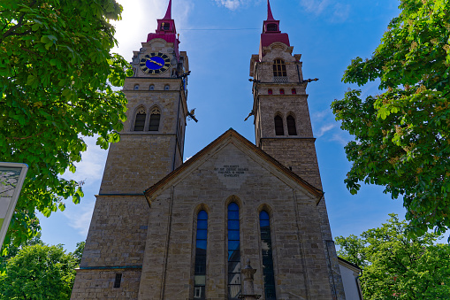 People walking by Notre-Dame de Québec Basilica-Cathedral at Quebec, Canada in front of the \