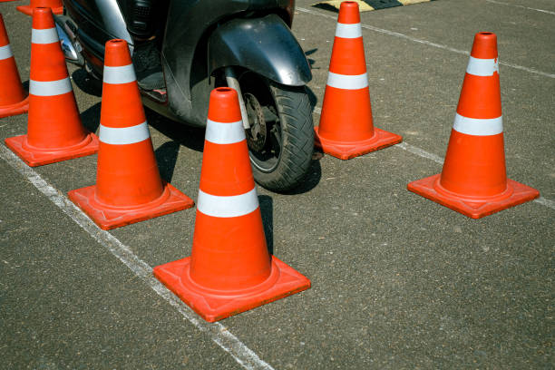 istock Man is learning to ride a bike Biker beginner on a motorcycle . 1589791912