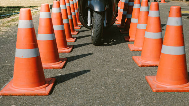 istock Man is learning to ride a bike Biker beginner on a motorcycle . 1589798478