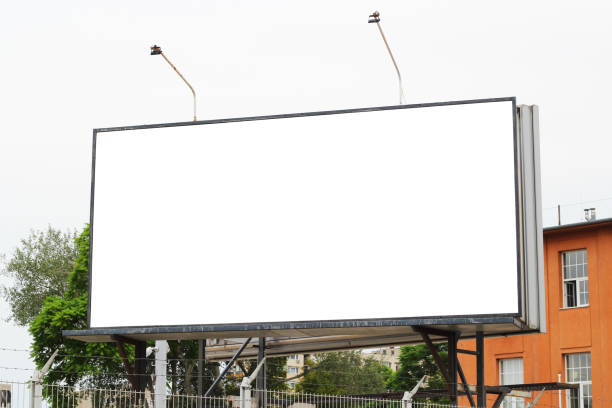 istock Empty space to display advertising campaign huge banner billboard mock up template. Blank billboard sign mockup in the urban environment. 1589823110