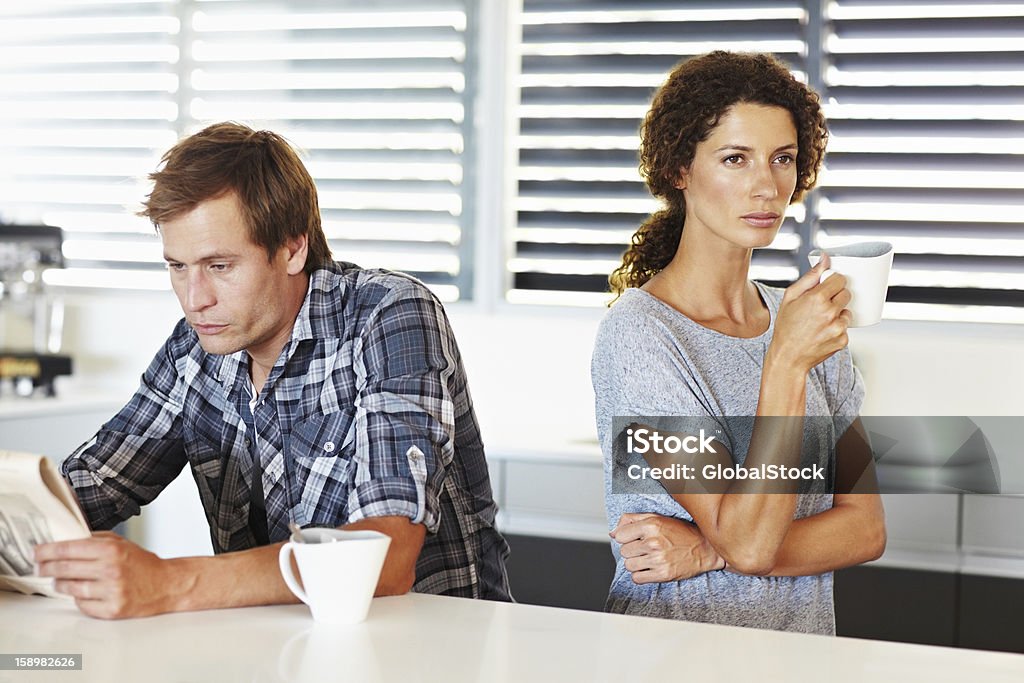 They're having communication problems Angry couple attempting starting their day by ignoring each other Anger Stock Photo