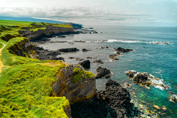 istock Ponta Delgada Island with rocky mountains and Atlantic Ocean 1589847875