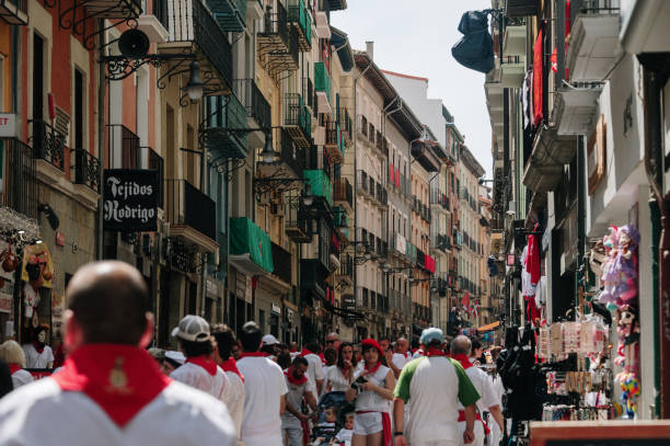 Pamplona, Spain - 7 July 2023: Estafeta street in Pamplona, Spain, with a crowd of people. This street is part of the San Fermin running of the bulls route.