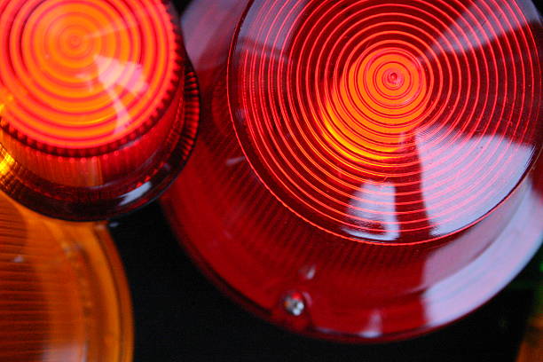 istock red signal light siren, close up 158986744