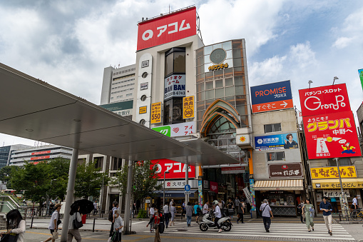 Tokyo, Japan - June 28, 2023 : People at Nakano Ward in Tokyo, Japan. The Nakano Sun Mall is the shopping street which connects Nakano Station.