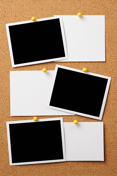 Blank photo with memo pinned on cork board Blank photo with memo pinned on cork board. bulletin board stock pictures, royalty-free photos & images