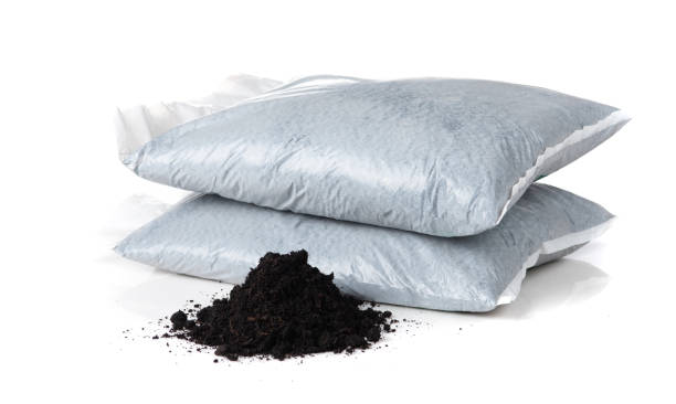 istock Organic soil with bag for planting on white background 1589885422