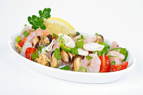 Seafood salad Seafood salad in a porcelain dish seafood salad stock pictures, royalty-free photos & images