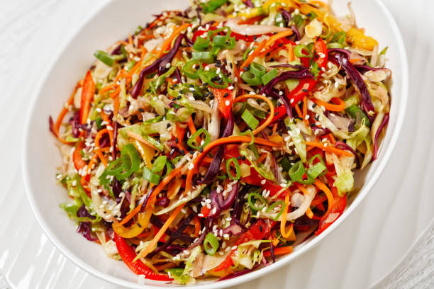 istock asian slaw, crunchy oriental cabbage salad in bowl 1589901381