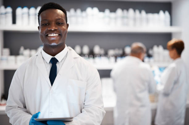 istock Portrait, science and black man, lab and tablet for research, connection and success with experiment. Face, happy African American male research and scientist in laboratory, device or online reading 1589908943