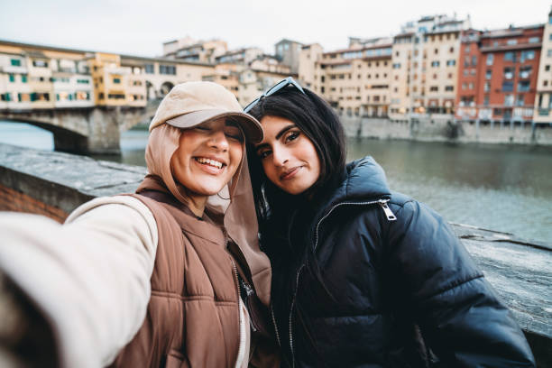 istock Two friends are taking a selfie in Florence, Italy 1589926400