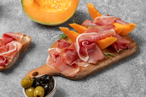 istock Italian prosciutto crudo with melon, Spanish jamon Serrano with melon 1589930097