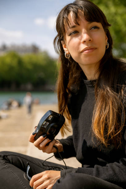 istock Woman with analog camera film 1589930239