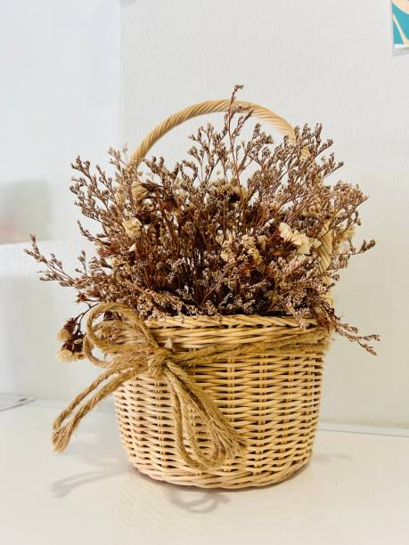 istock Beautiful dried flowers in a basket 1589947234