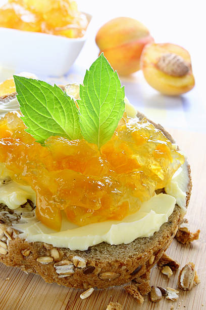 istock Sandwich with butter and peach jam 158995097