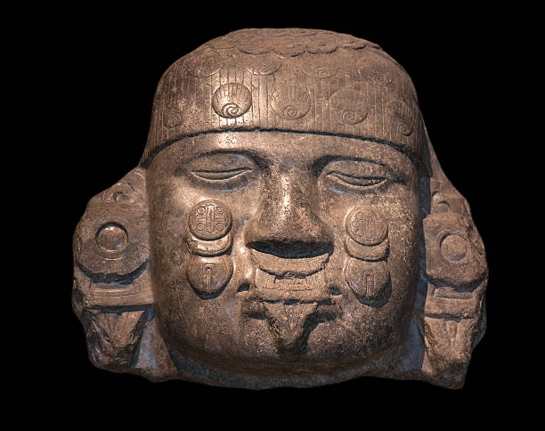 Ancient Maya Statue on the Rocks near the Ocean