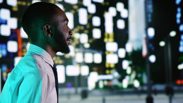 istock Businessman admires skyscrapers at night 1589964345