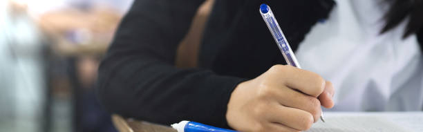 istock The students were doing the exams inside the classroom with stress.Assessment examination of high school students dressed in uniform 1589972664