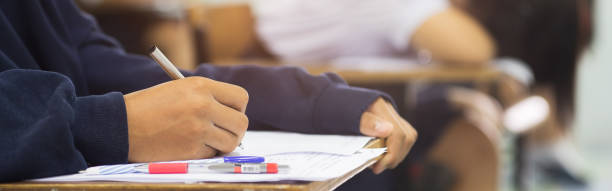 istock The students were doing the exams inside the classroom with stress.Assessment examination of high school students 1589972666