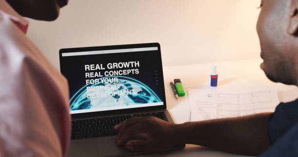 istock Laptop, screen and business people on website for information, homepage and user interface at desk. Technology, development and man and woman typing on computer for growth tips, web design and search 1589980209