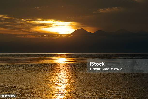 Tramonto Terra - Fotografie stock e altre immagini di Acqua - Acqua, Alba - Crepuscolo, Ambientazione esterna