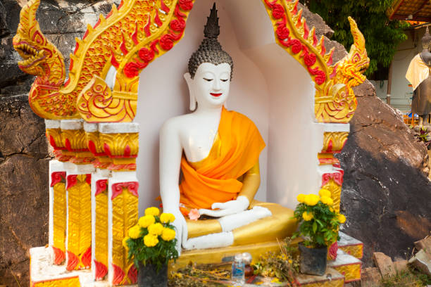 Small shrine with white thai buddha at Wat Doi Thaen Phra Pha Luang in San Sai  district of Chiang Mai