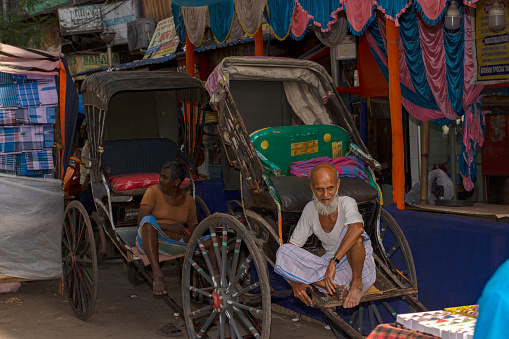 6th April, 2023, Kolkata, West Bengal, India: A old man with his famous hand pulled rickshaw of Kolkata.