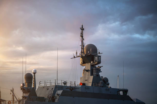 Navigation radar tower on warship at sunset close-up