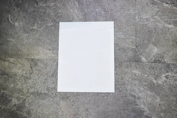 istock White envelope mock-up, blank template on marble grey grunge background 1590038098