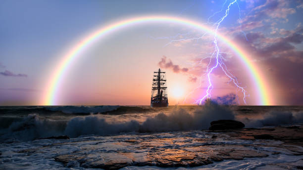Sailing old ship in storm sea on the background heavy clouds with lightning