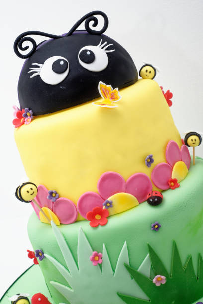 Animal figurine Birthday party cake - Pastel colourful birthday cake. Festive cake with a colourful marzipan