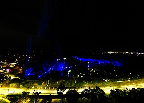 Laser light show on the Murray river lighting up the forest in Moama Echuca border in the Riverina rural NSW/Victoria