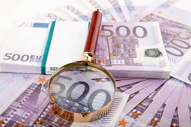 istock Euros with magnifying glass 159005550