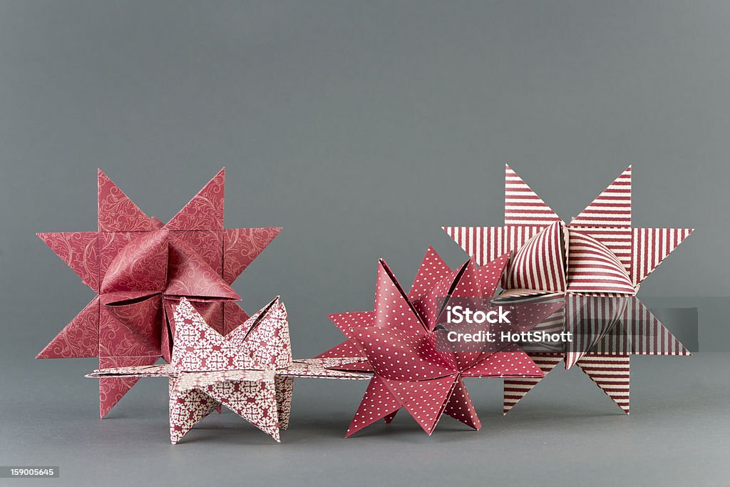 Froebel Stars Four Froebel stars made of paper with different patterns. Selective focus. Paper Stock Photo