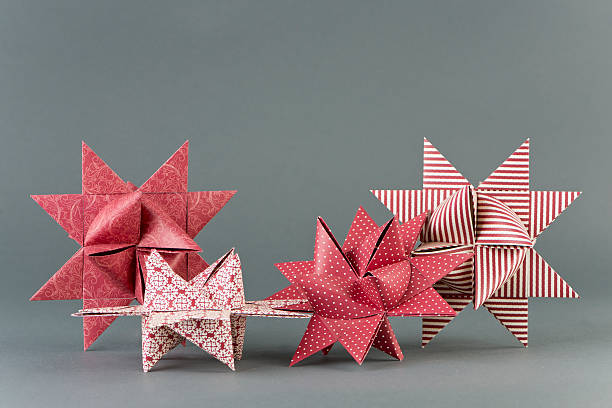 Froebel Stars Four Froebel stars made of paper with different patterns. Selective focus. hott stock pictures, royalty-free photos & images