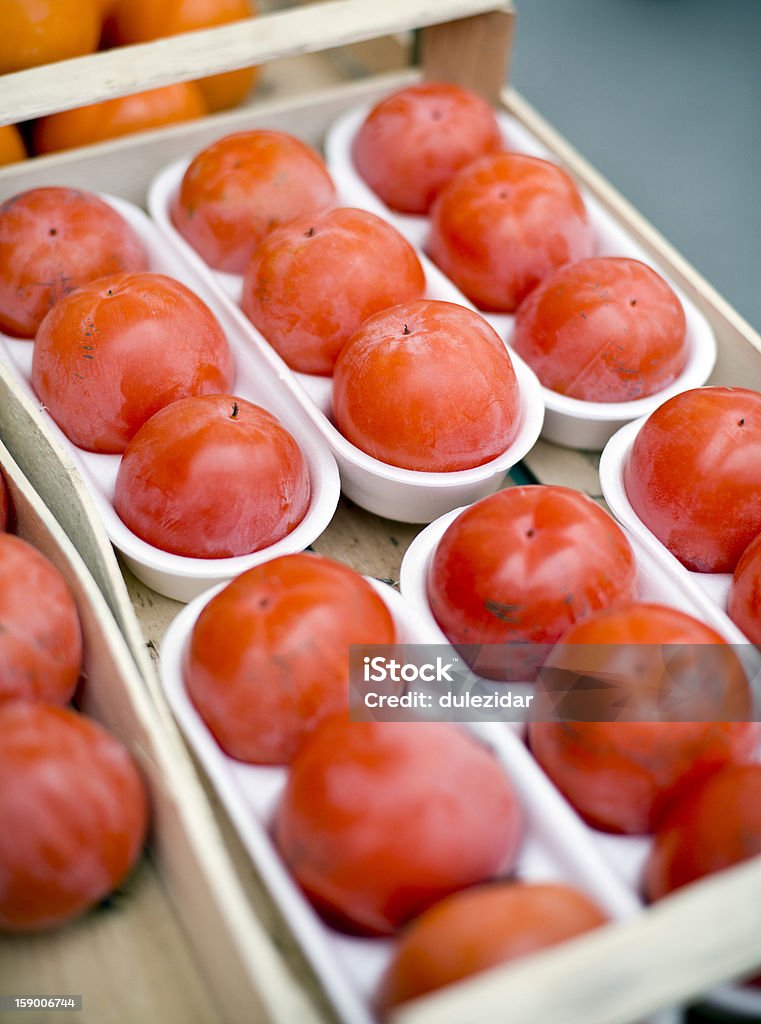 Persimmon Persimmons in wooden box close up shoot Asian Culture Stock Photo