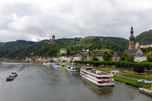 Cochem, Germany - August 1st 2023: People visiting Cochem (Germany) \n\nCochem is the seat of and the biggest town in the Cochem-Zell district in Rhineland-Palatinate, Germany. With just over 5,000 inhabitants, Cochem falls just behind Kusel, in the Kusel district, as Germany's second smallest district seat. Since 7 June 2009, it has belonged to the Verbandsgemeinde of Cochem. \nSource: Wikipedia