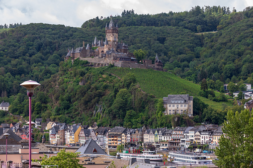 Cochem, Germany - August 1st 2023: People visiting Cochem (Germany) \n\nCochem is the seat of and the biggest town in the Cochem-Zell district in Rhineland-Palatinate, Germany. With just over 5,000 inhabitants, Cochem falls just behind Kusel, in the Kusel district, as Germany's second smallest district seat. Since 7 June 2009, it has belonged to the Verbandsgemeinde of Cochem. \nSource: Wikipedia