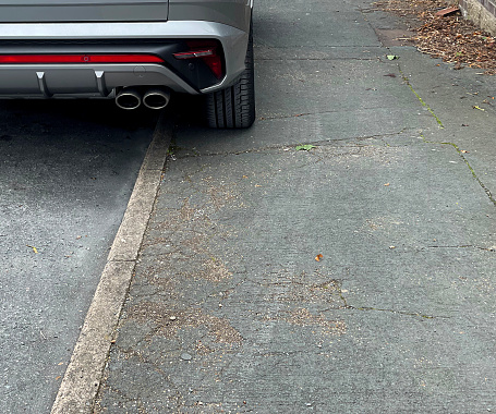 Car parking on a pavement