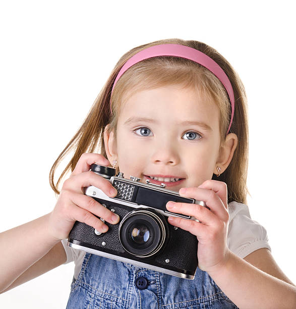 istock Little girl with old camera isolated 159008815