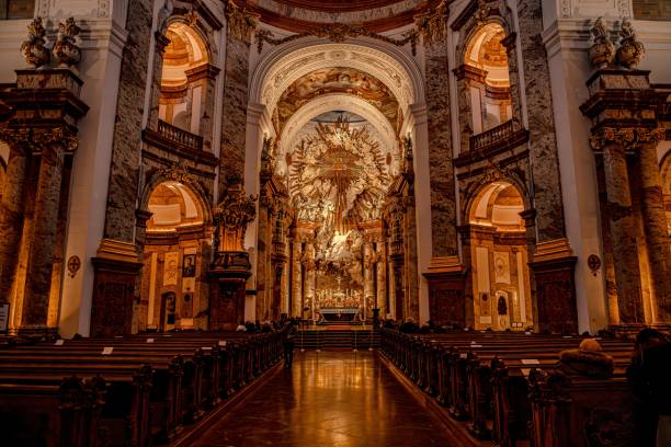 istock a view from inside of a cathedral with a gold stained front wall and pews 1590090890