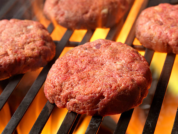 istock Raw Hamburgers on the BBQ 159009099