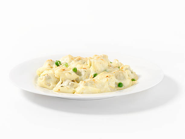 Baked Tortellini with Peas in a Cream Sauce with Natural Drop shadow -Photographed on Hasselblad H1-22mb Camera 