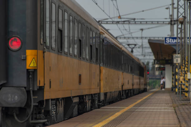 Container train in the track shipping yard. Cargo train moving in the container terminal. Freight Train Car Block Assembly in Container Terminal