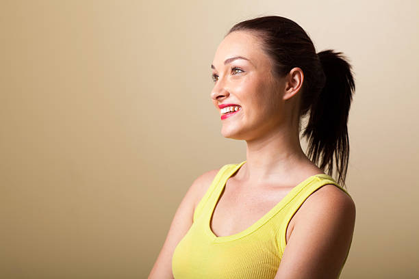 istock happy young woman studio portrait 159011442