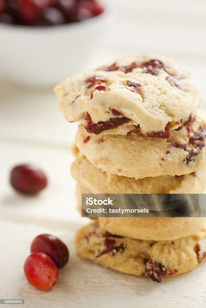 Cranberry cookies Stack of cranberry cookies on a white wooden table garnished with cranberries.  Shallow depth of field. Shortbread Stock Photo