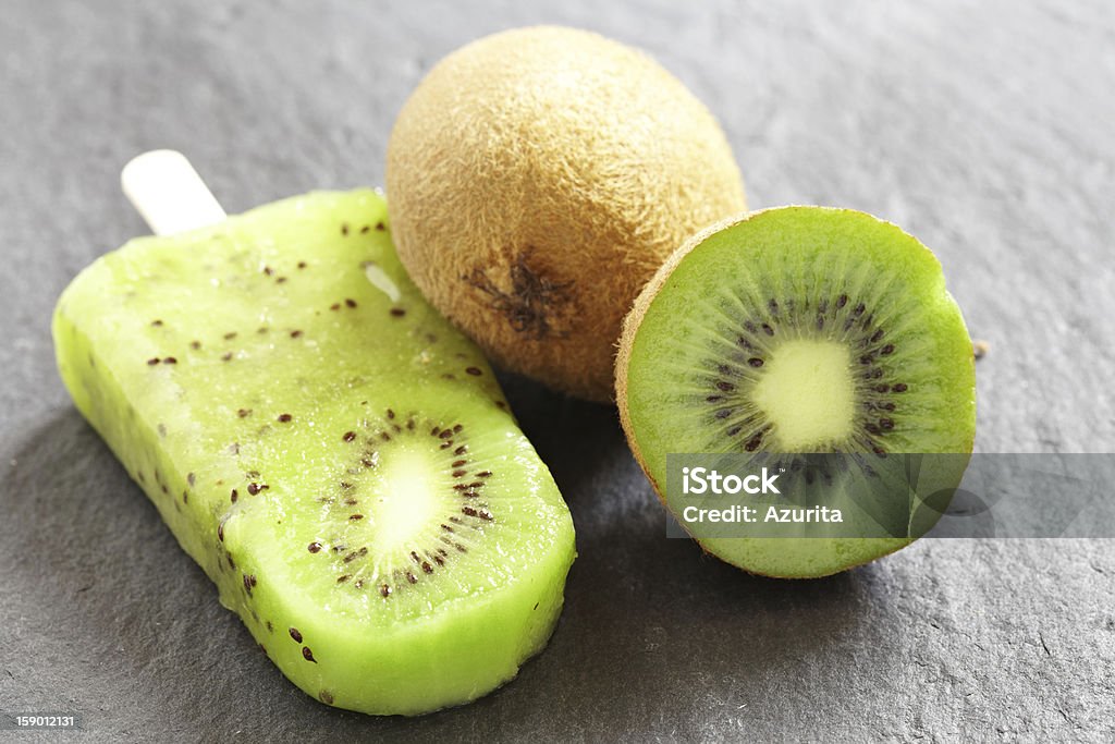 Kiwi Ice Cream Popsicle Kiwi Ice Cream Popsicle with Lime Backgrounds Stock Photo